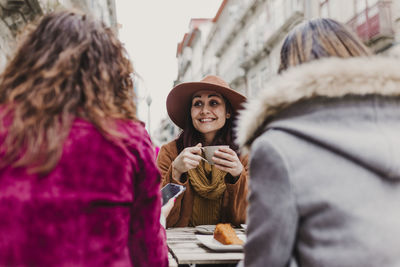 Young woman holding ice cream