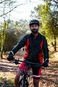 Portrait of young man riding bicycle