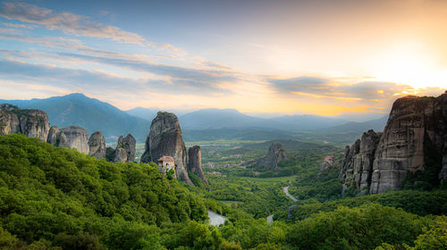 Majestic meteora, sunrise over famous flying monastery. explore unesco's treasures