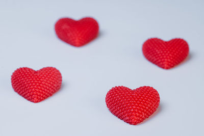 Close-up of heart shape over white background