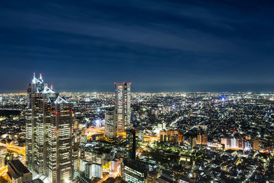 High angle view of illuminated city at night