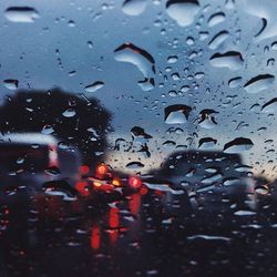 Close-up of rain drops on water