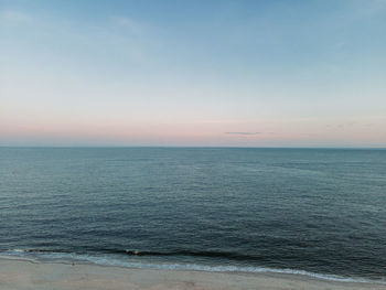 Scenic view of sea against sky during sunset. ocean view from above.