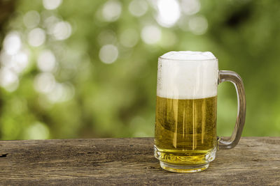 Close-up of beer glass on table