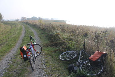 Bicycle on field against sky