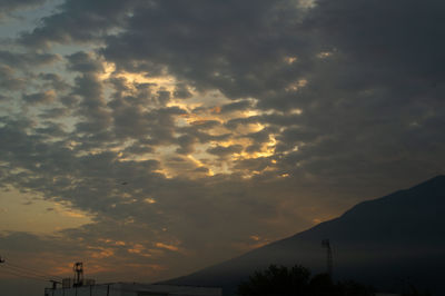 Low angle view of dramatic sky during sunset