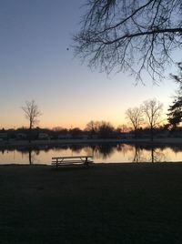 Scenic view of calm lake at sunset