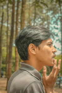 Portrait of man in forest