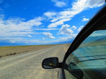 High angle view of road against cloudy sky
