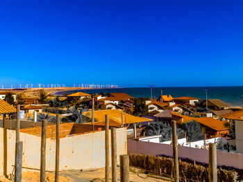 Scenic view of beach against clear blue sky