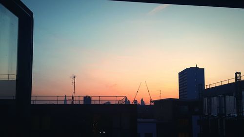 Cityscape against sky during sunset