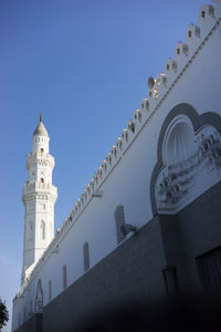 Low angle view of mosque against blue sky