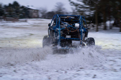 Car on snow covered field