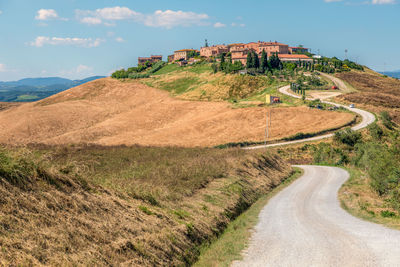 View of the road leading to mucigliani village - small place surrounded by agricultural landscapes, 