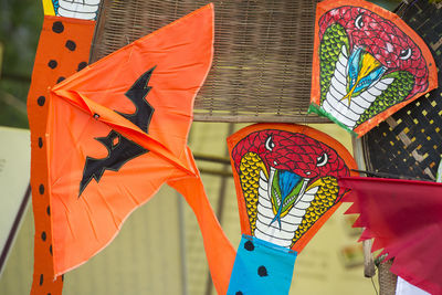 Various kites on stand at market stall