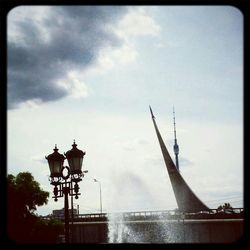 Low angle view of built structure against cloudy sky