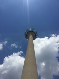 Low angle view of building against cloudy sky