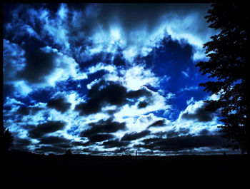 Scenic view of landscape against cloudy sky