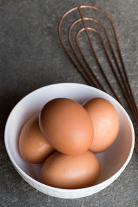 High angle view of eggs in bowl on table