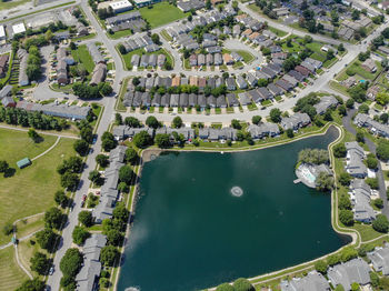 High angle view of lake in city during sunny day