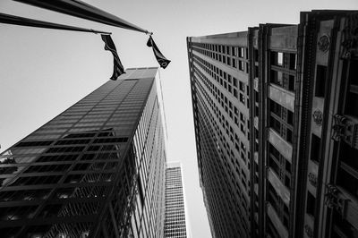 Low angle view of skyscrapers against clear sky