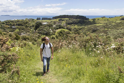 Full length of woman on land against sky