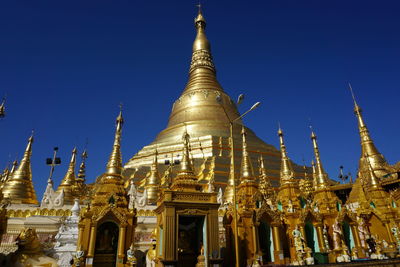 Low angle view of pagoda against blue sky