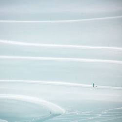 Aerial view of person snowboarding on snow