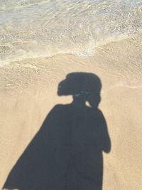 Shadow of man on beach