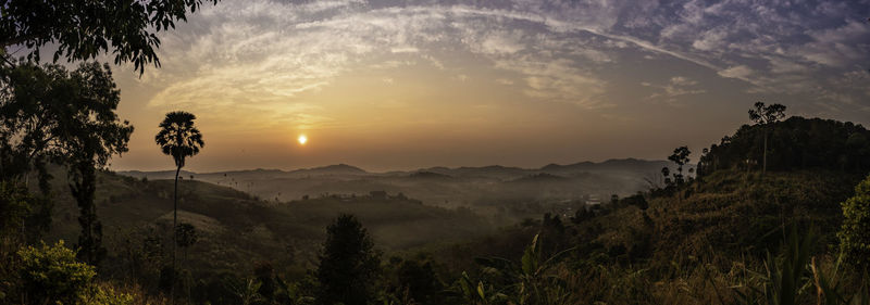 Scenic view of mountains against sky during sunset