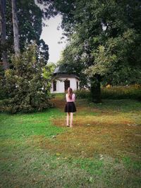 Portrait of woman standing on field