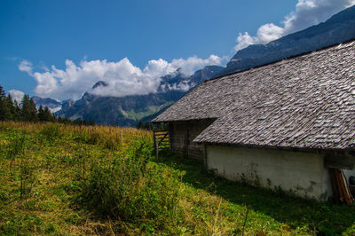 House on field against sky