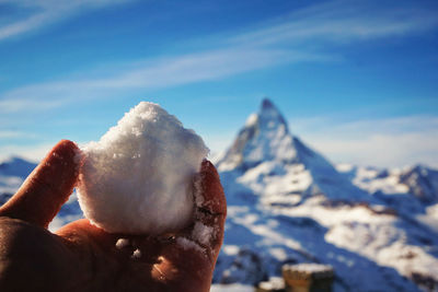 Close-up of hand holding snowball