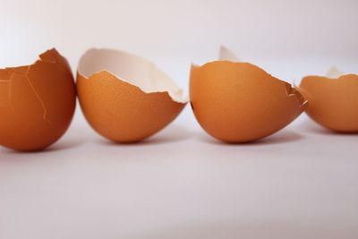 Close-up of orange over white background