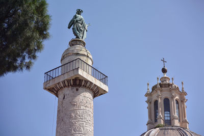 Low angle view of statue against sky