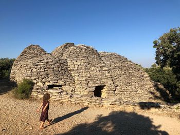 High angle view of girl walking at historic place