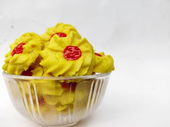 Close-up of dessert in bowl against white background