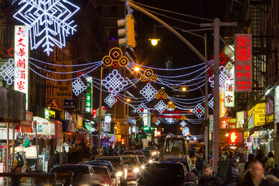 Illuminated city street at night