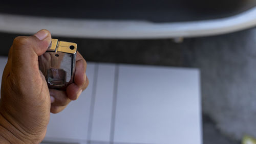 Close-up of man photographing through smart phone