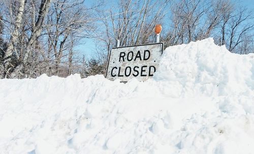 Close-up of road sign on snow
