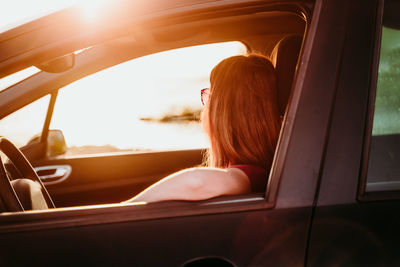 Woman sitting in car