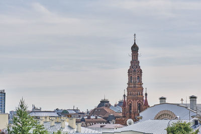 Roofs of buildings in downtown kazan, russia. bell tower of epiphany cathedral.