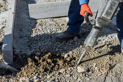 Low section of man working at construction site