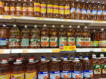 Multi colored bottles on display at store