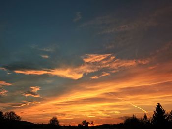 Low angle view of dramatic sky during sunset