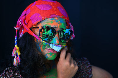 A young girl celebrating the festival of colours, holi.