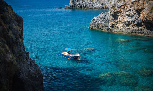 High angle view of rocks in sea