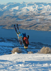 Man skiing on snowcapped mountain