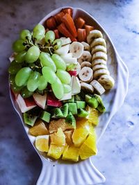 High angle view of chopped vegetables in bowl on table