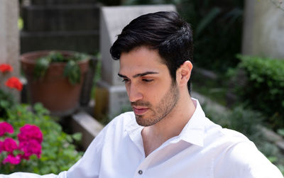 Portrait of young man looking at camera